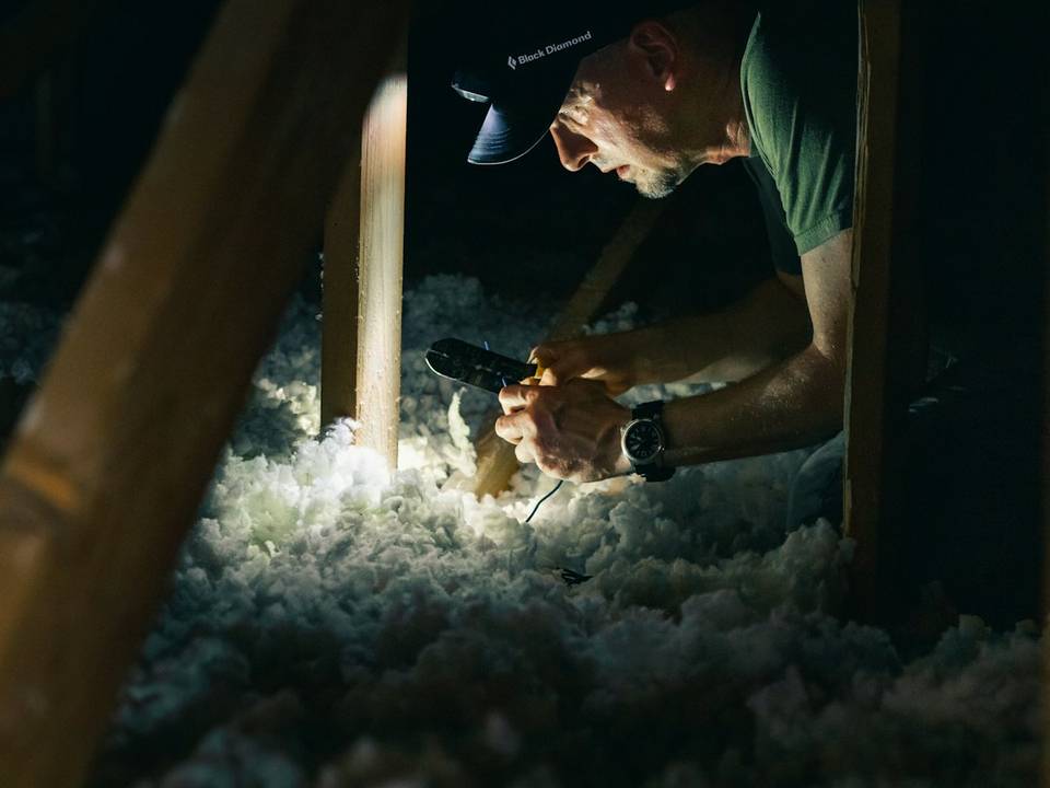 Attic floor covered with an even layer of blown in insulation